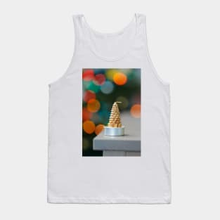 Christmas tree shaped candle on wooden cupboard against christmas lights Tank Top